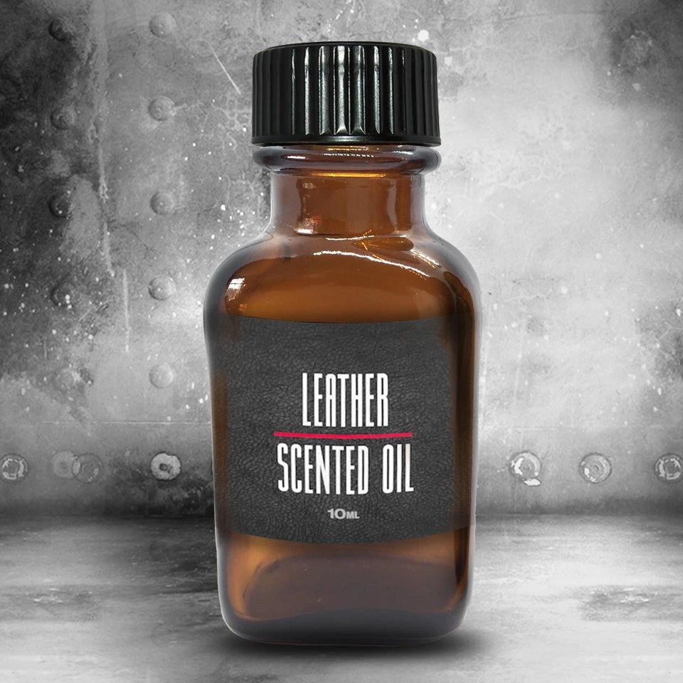 Amber 10ml bottle of leather scented oil with a black cap on riveted steel, Fort Troff gay gear at Boyzshop