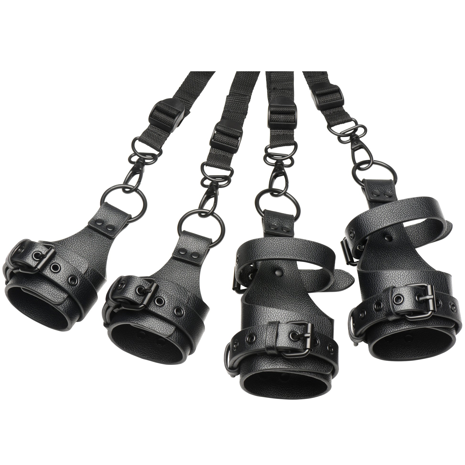 Set of black leather restraints with straps on a white background