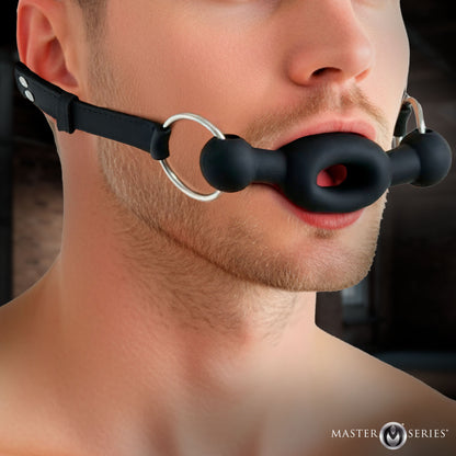 FORCED silicone feeding gag with locking buckle and steel rings for men's bondage by Master Series 