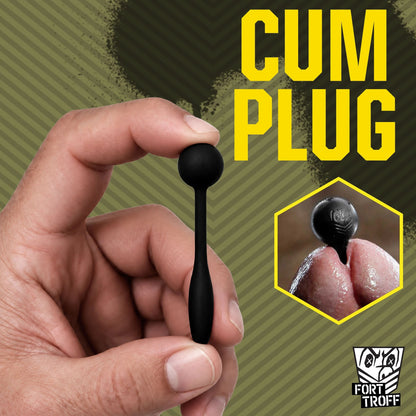 Hand holding a Cum Plug penis plug with an inset of it seated in a cock tip, Fort Troff gay gear at Boyzshop