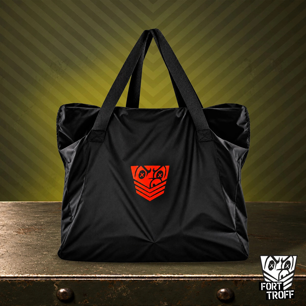 Rimmer Bag black ballistic nylon carry bag with red Fort Troff shield, standing on a steel table, Fort Troff gay gear at Boyzshop