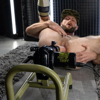 Bearded model on his back spreading his ass over the Grunt thrusting machine, Fort Troff gay gear at Boyzshop