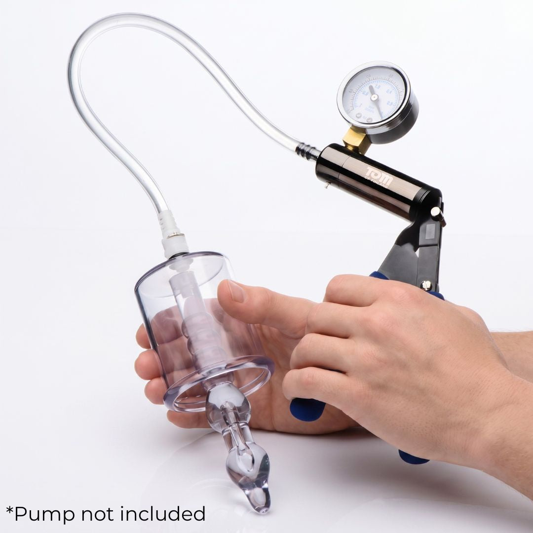 Anal pump cylinder connected to a compatible vacuum hand pump, illustrating the complete setup for use. Pump shown for demonstration and not included.