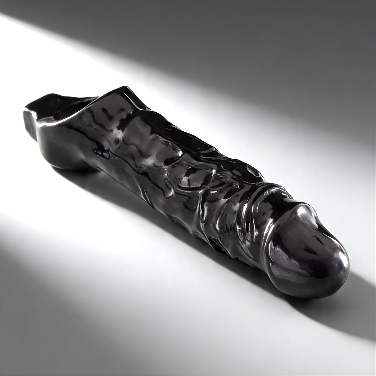 sleek black cock sheath with pronounced texture designed for enhanced pleasure and fit