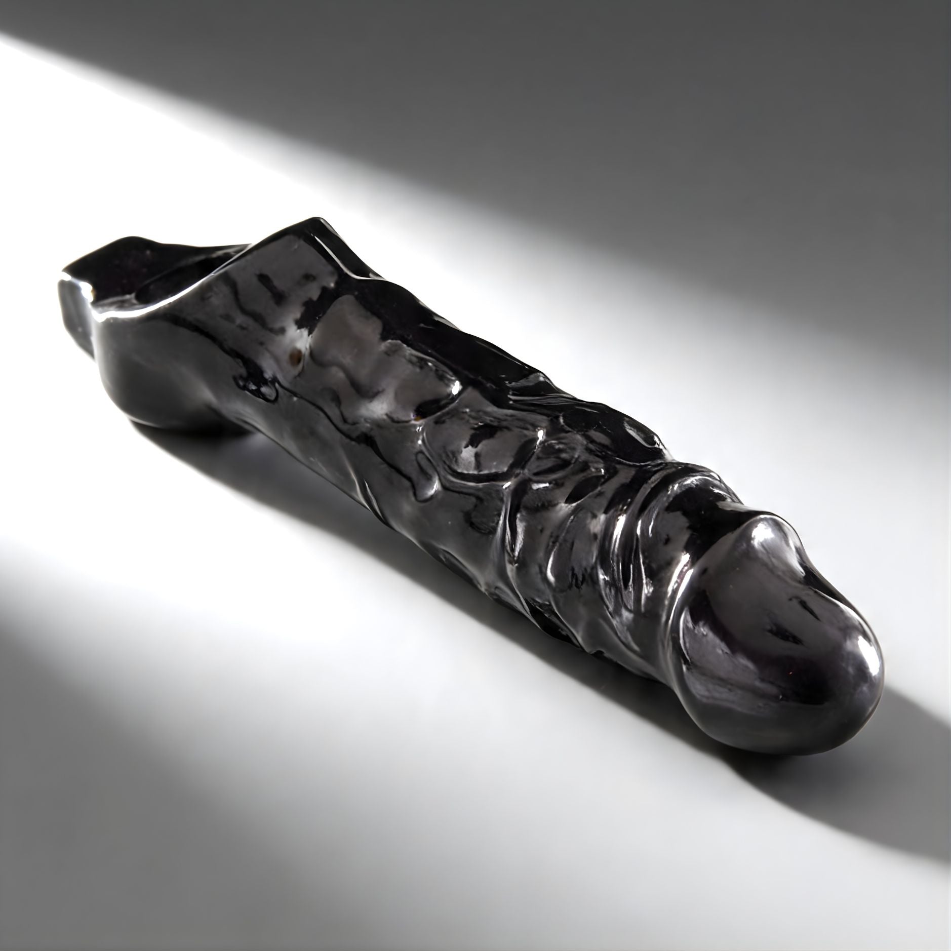 sleek black cock sheath with pronounced texture designed for enhanced pleasure and fit