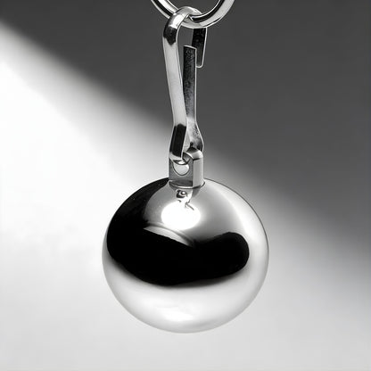 close up of polished chrome ball weight with clip attachment highlighting smooth reflective surface and solid metal build
