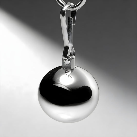 close up of polished chrome ball weight with clip attachment highlighting smooth reflective surface and solid metal build