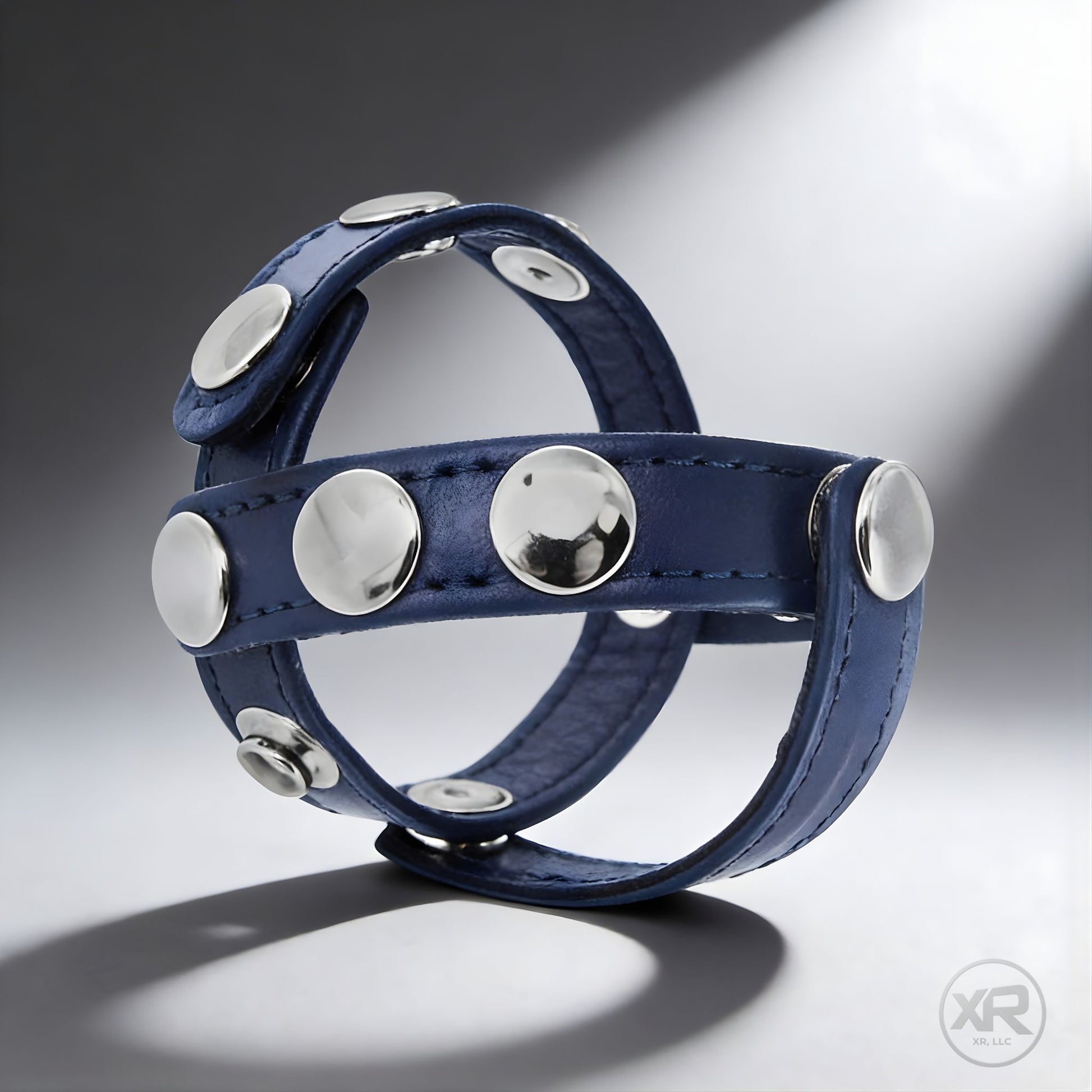 studded cobalt blue leather cock and ball harness for gay men featuring adjustable straps for a secure supportive fit