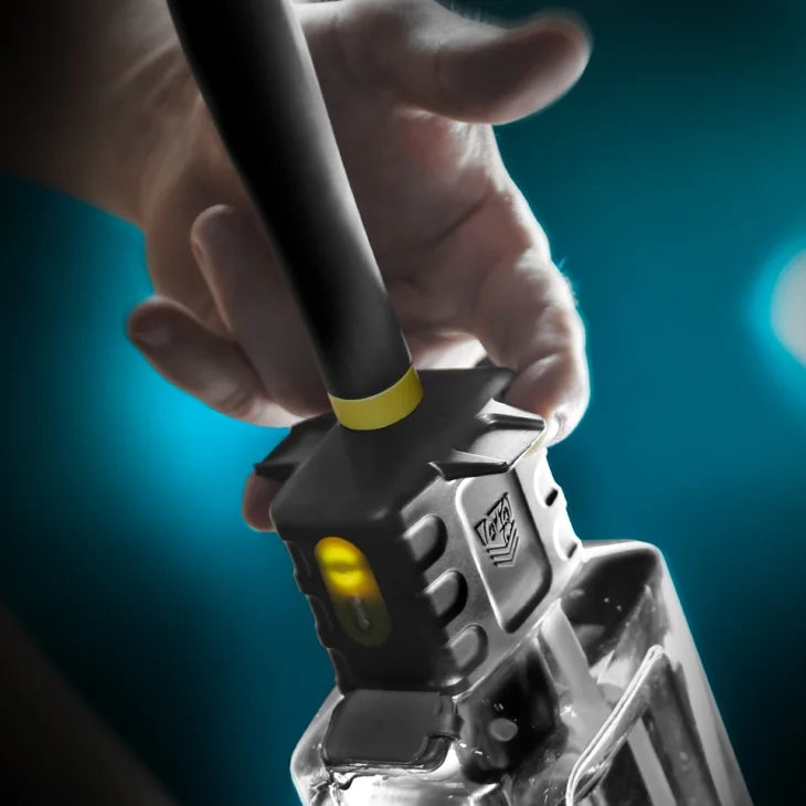 Hand pressing the button on the Hydro-Pro rechargeable douche pump, close-up, Fort Troff gay gear at Boyzshop