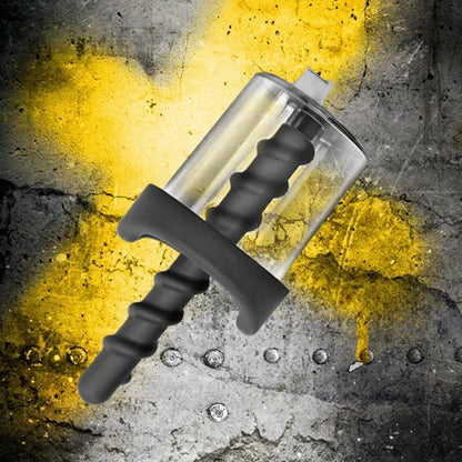 Rosebud Pump clear anal pump cylinder with black spiral stem over a cracked yellow concrete wall, Fort Troff gay gear at Boyzshop