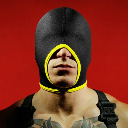 Blind Skullfuck bondage hood with yellow mouth trim, eyes covered, lips exposed, red backdrop, Fort Troff gay gear at Boyzshop