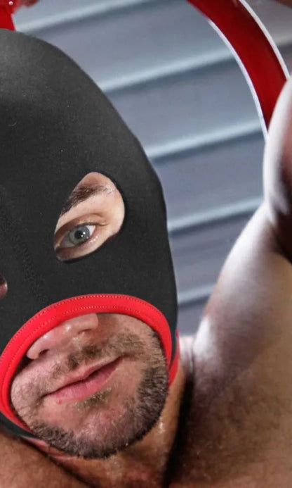 Close-up of a man in the red trim Skullfuck open-mouth bondage hood, Fort Troff gay gear at Boyzshop