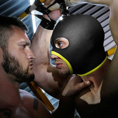 Man in the yellow Skullfuck hood face to face with a bearded partner, Fort Troff gay gear at Boyzshop