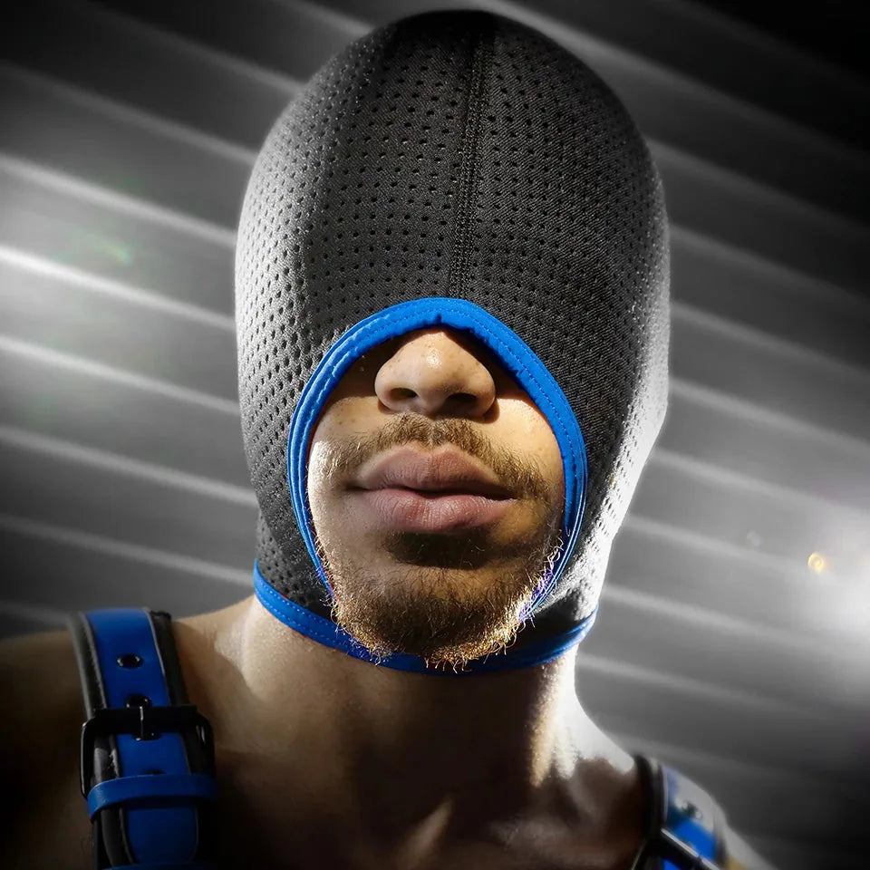 Model wearing the Perforated bondage hood in black mesh with blue trim, open mouth over his beard, Fort Troff gay gear at Boyzshop