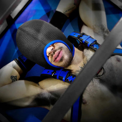 Model lying back in the Perforated mesh neoprene hood, blue trim ringing his open mouth, Fort Troff gay gear at Boyzshop