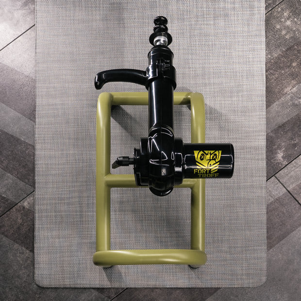 Grunt fuck machine from above on its mat, olive steel frame plus black motor, Fort Troff gay gear at Boyzshop