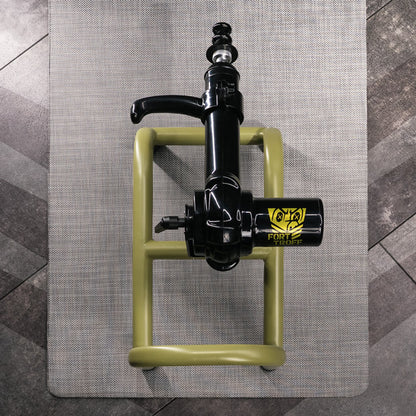 Grunt fuck machine from above on its mat, olive steel frame plus black motor, Fort Troff gay gear at Boyzshop