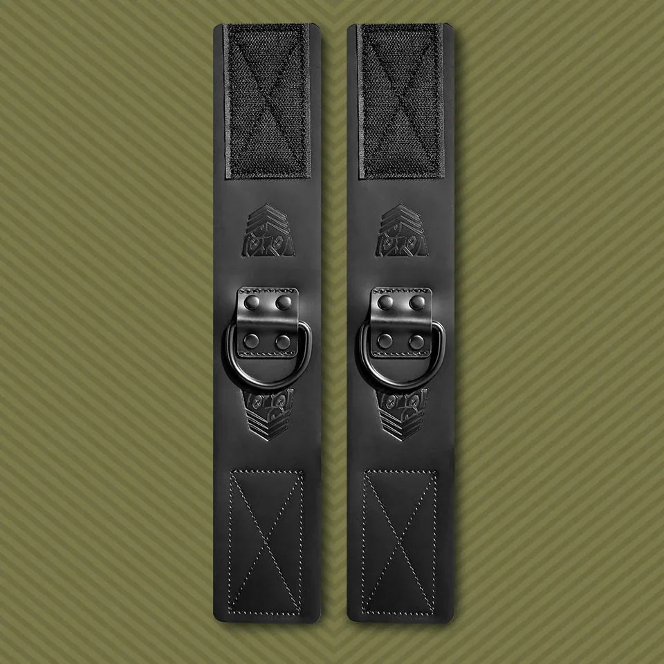 Leather ankle cuffs pair standing upright on olive, Velcro ends with embossed FT shield, Fort Troff gay gear at Boyzshop