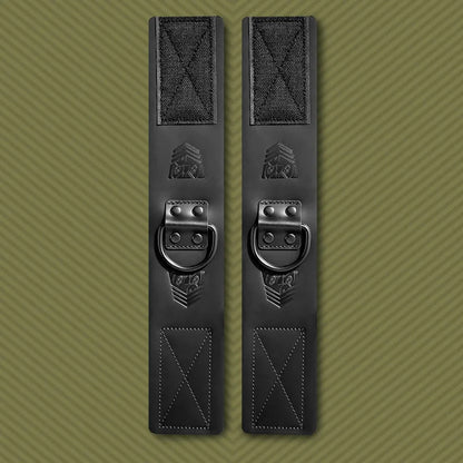 Leather ankle cuffs pair standing upright on olive, Velcro ends with embossed FT shield, Fort Troff gay gear at Boyzshop