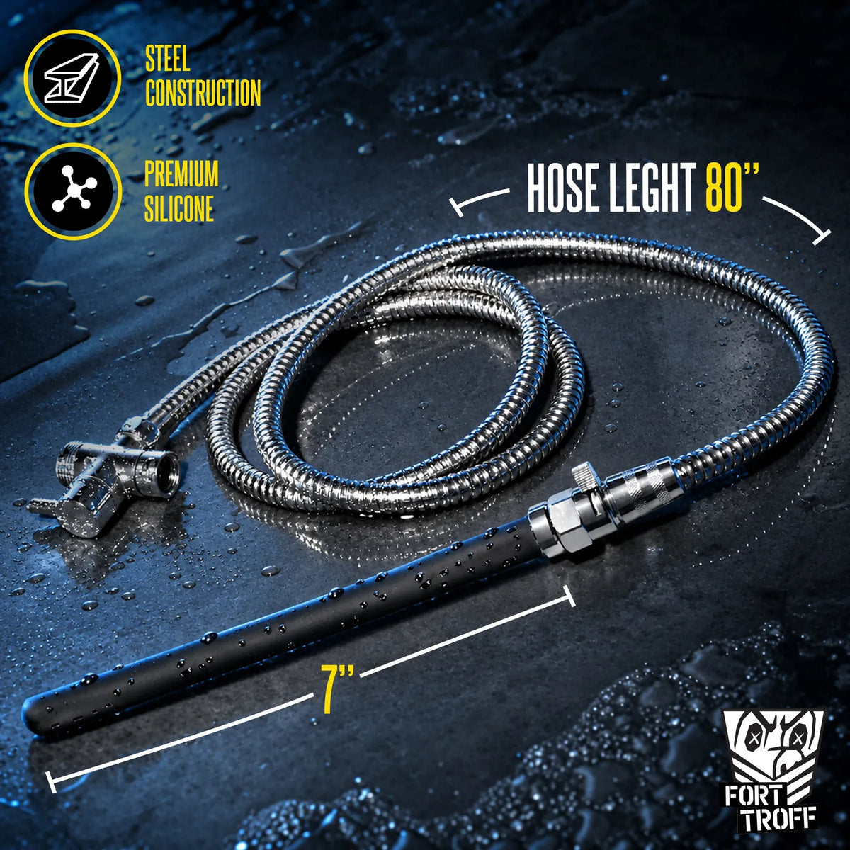 Apex shower enema kit steel hose coiled with the black nozzle on wet concrete, length callouts, Fort Troff gay gear at Boyzshop