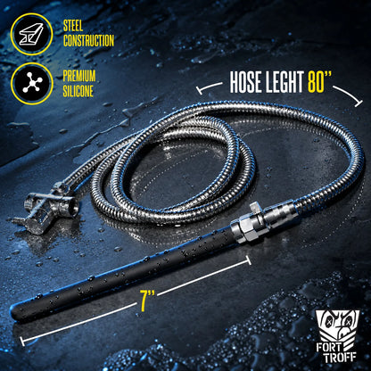 Apex shower enema kit steel hose coiled with the black nozzle on wet concrete, length callouts, Fort Troff gay gear at Boyzshop