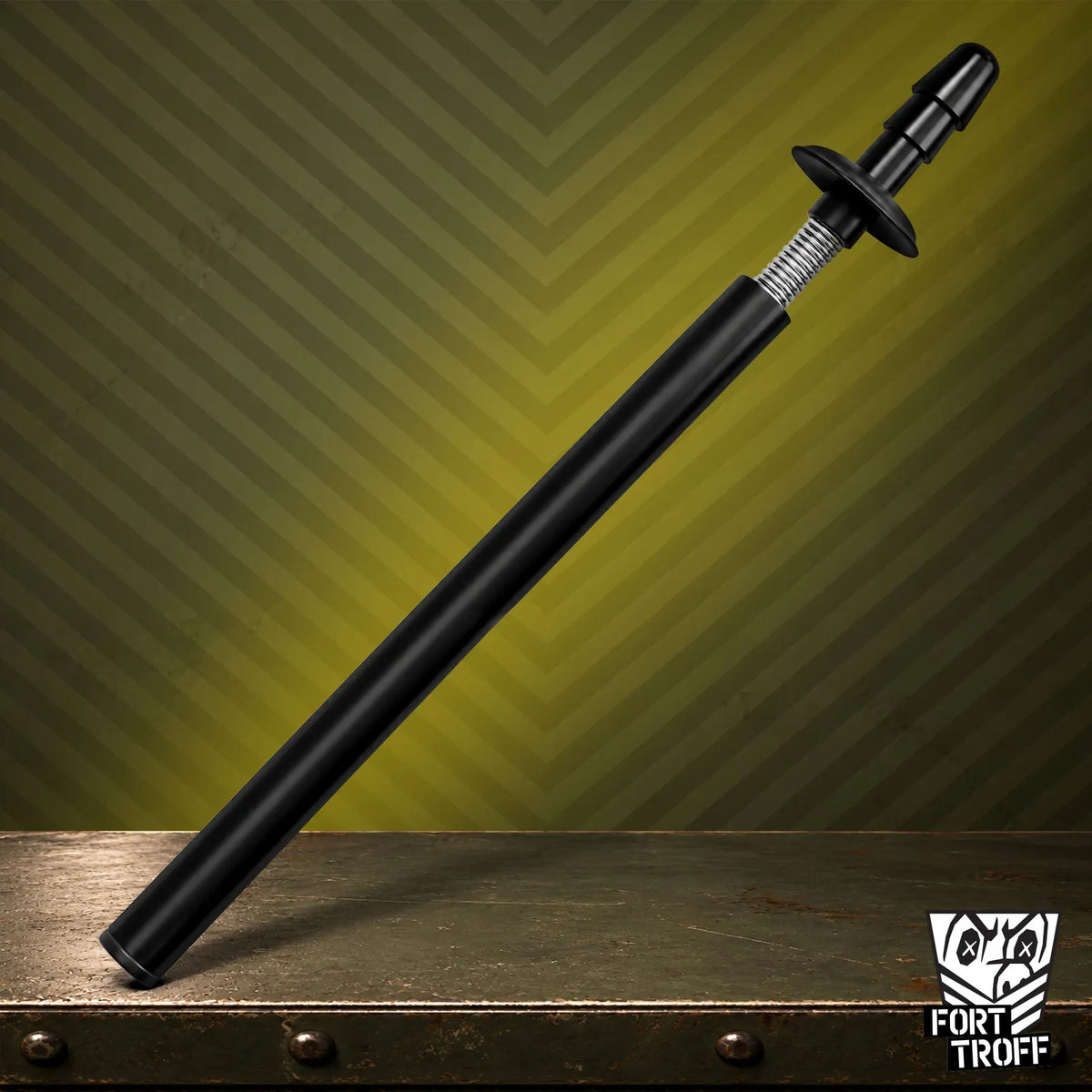 Black Spring Fuk Bar leaning on a steel crate, Vac-U-Lock sling dildo bar on olive stripes, Fort Troff gay gear at Boyzshop