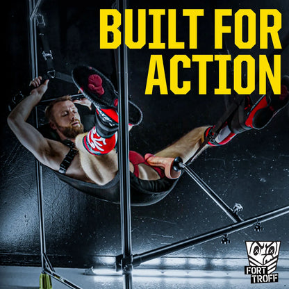 Bearded model in a sling with legs up riding a dong on the Spring Fuk Bar, Built For Action graphic, Fort Troff gay gear at Boyzshop