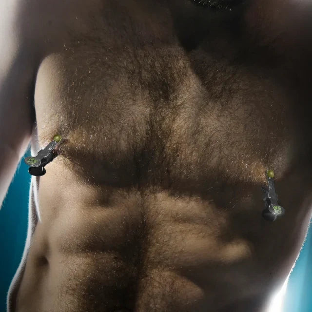 Hairy bearded torso with steel nipple clamps on both nipples, Fort Troff gay gear at Boyzshop