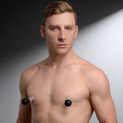male model wearing clear nipple suckers showing dual nipple pump suction placement