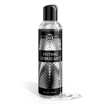 Master Series fisting lubricant bottle with clear water based lubricant spill on white background