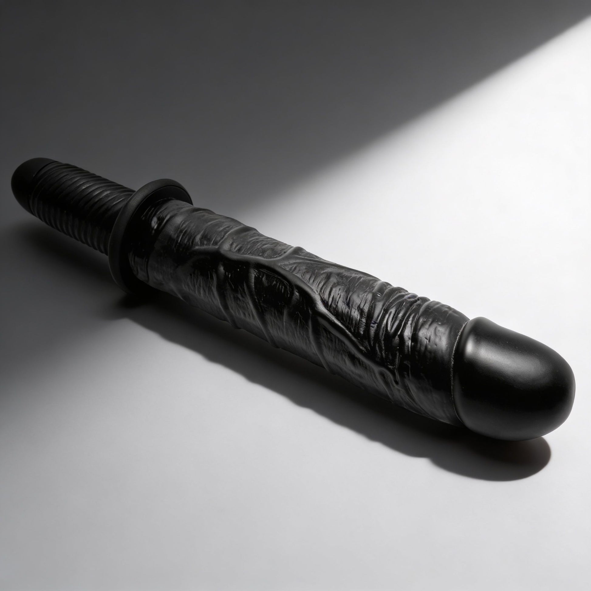 black Master Series Violator 13 Mode XL vibrating dildo thruster isolated on gray background showing realistic textured shaft