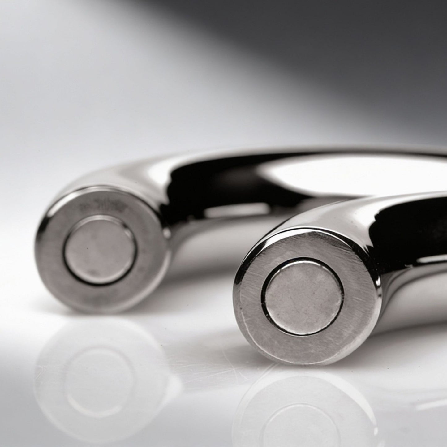 close up of magnetic connection ends on polished stainless steel cock ring halves