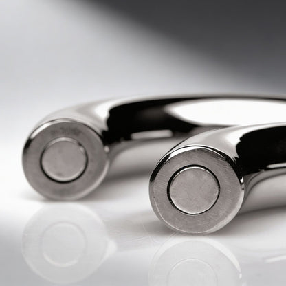 close up of magnetic connection ends on polished stainless steel cock ring halves