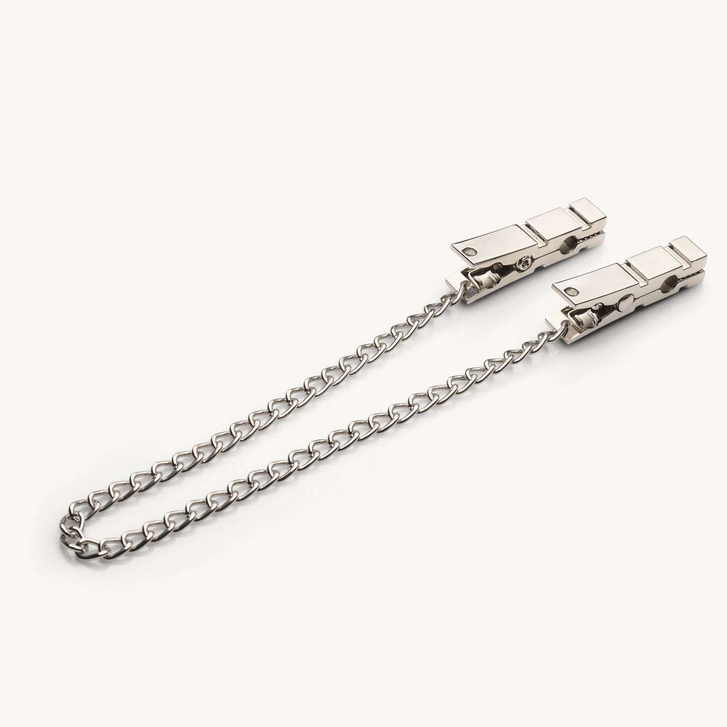 Pulling the chain on the Naughty Pleasure nipple clamps