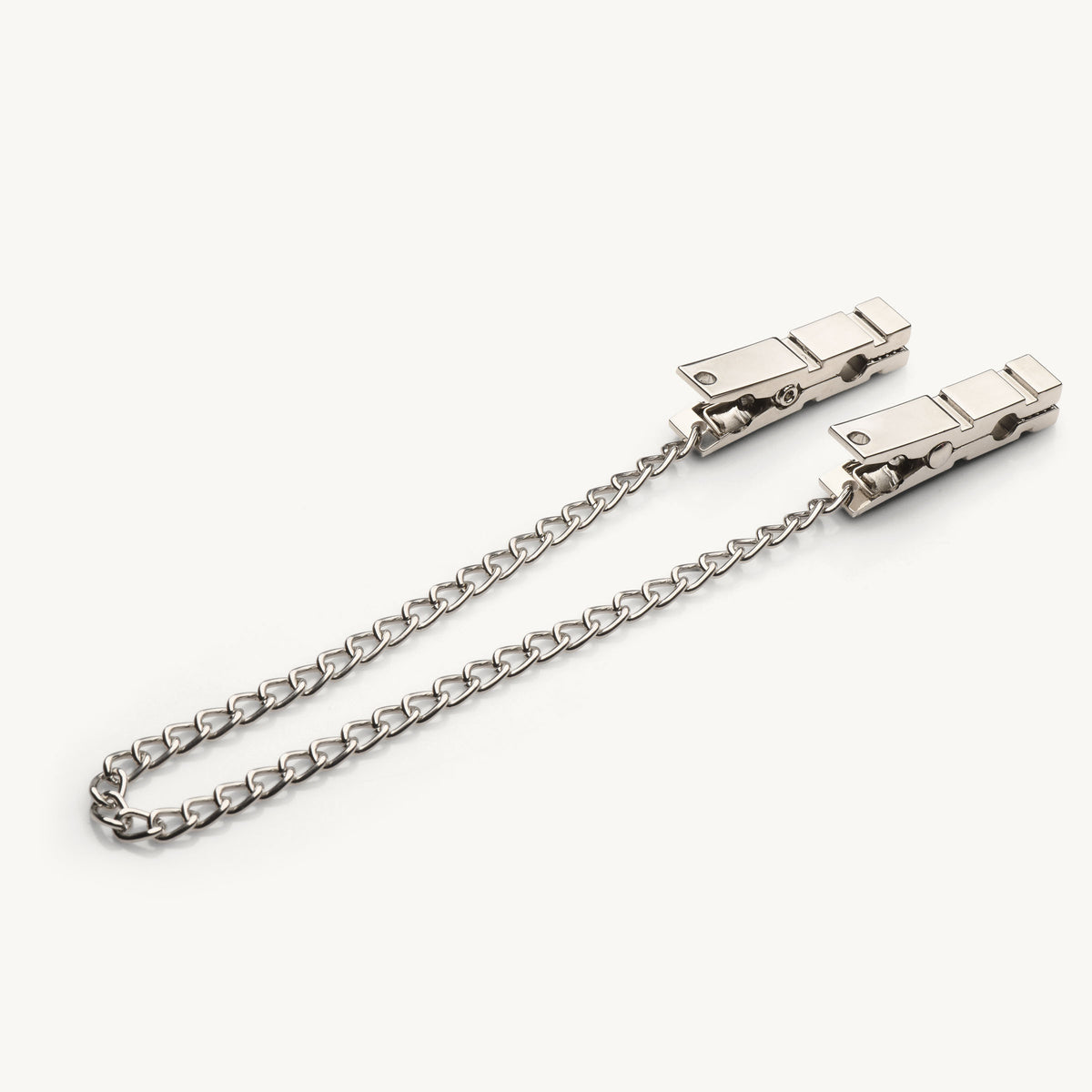 Pulling the chain on the Naughty Pleasure nipple clamps