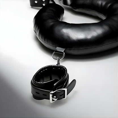 close up of padded collar strap with metal buckle and attachment ring from thigh sling restraint