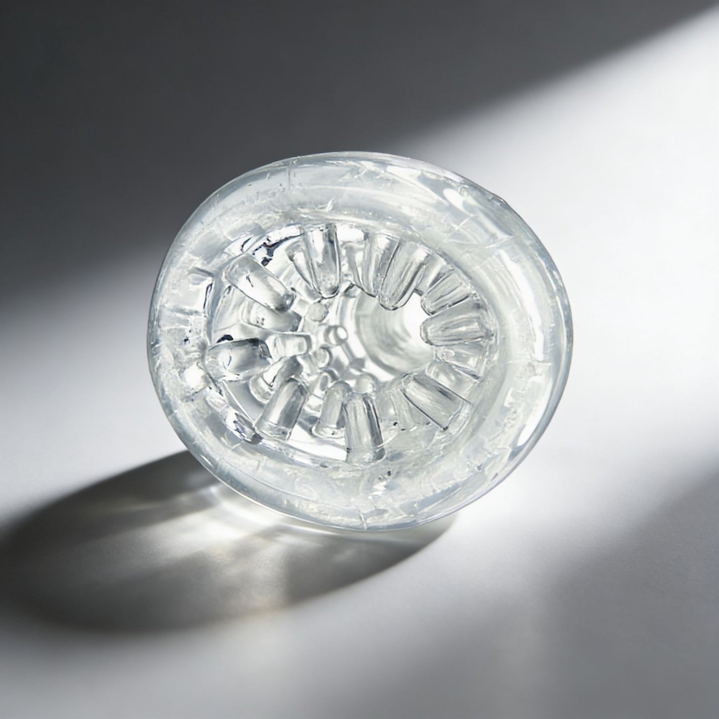 front-facing view of the Palm-Tec LX20 Intense Stroker revealing the detailed internal texture pattern and flexible clear material