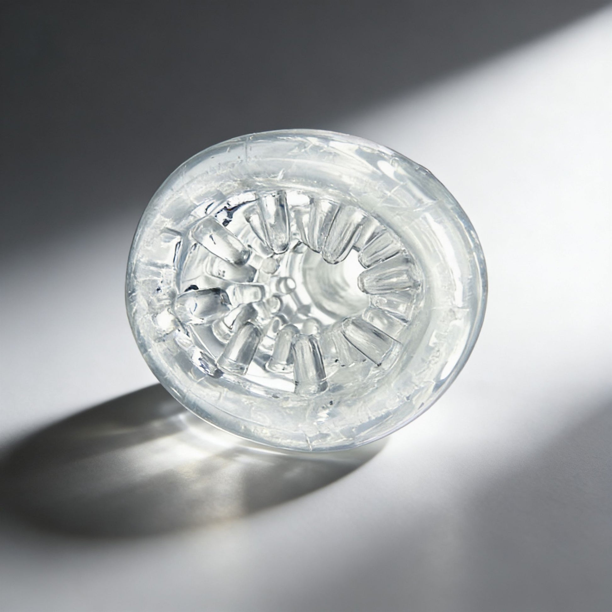 front-facing view of the Palm-Tec LX20 Intense Stroker revealing the detailed internal texture pattern and flexible clear material