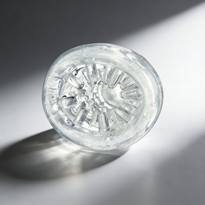 front-facing view of the Palm-Tec LX20 Intense Stroker revealing the detailed internal texture pattern and flexible clear material
