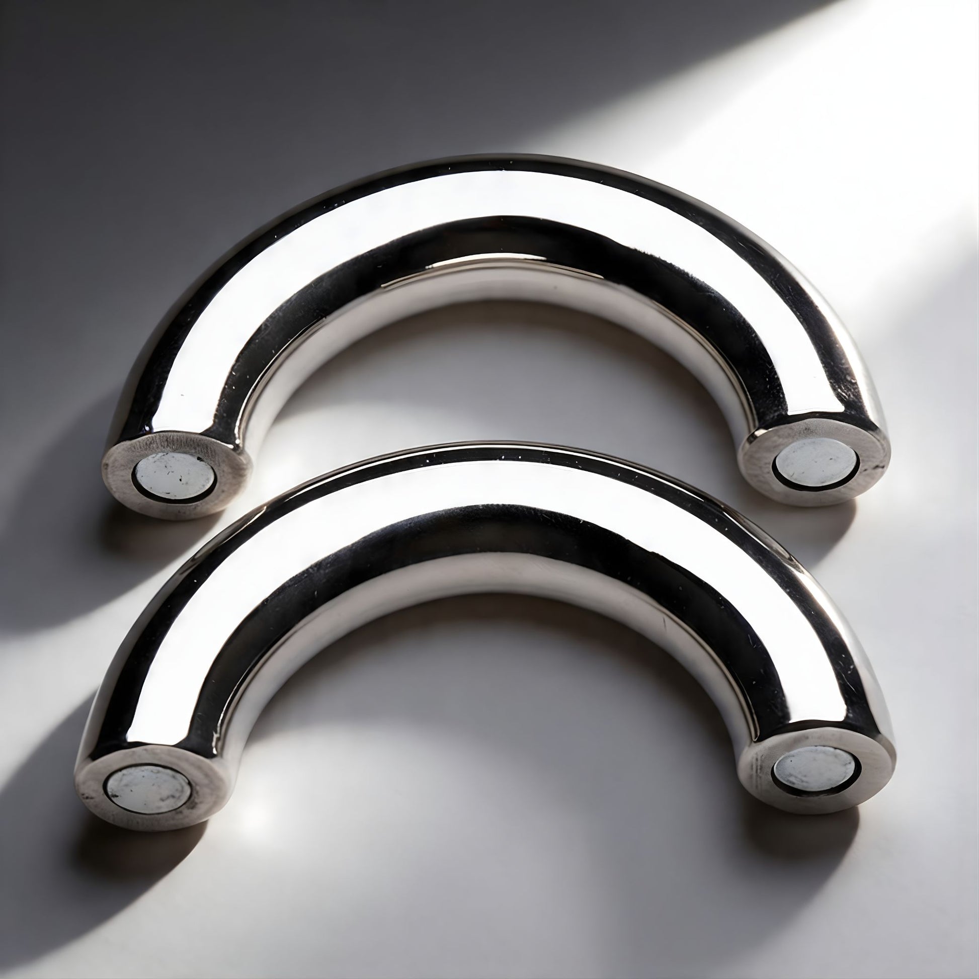 polished stainless steel magnetic cock ring with curved design two piece