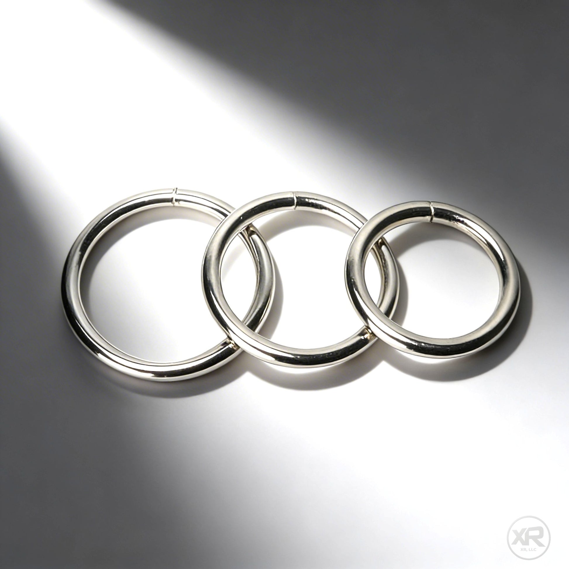 steel cock rings in multiple sizes for gay men designed for a firm restrictive fit and versatile use with strap on harnesses