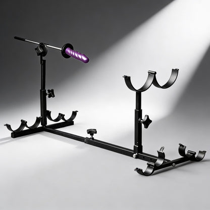 adjustable black metal stockade bondage frame with mounted purple fucking rod attachment and padded restraint supports on gray background