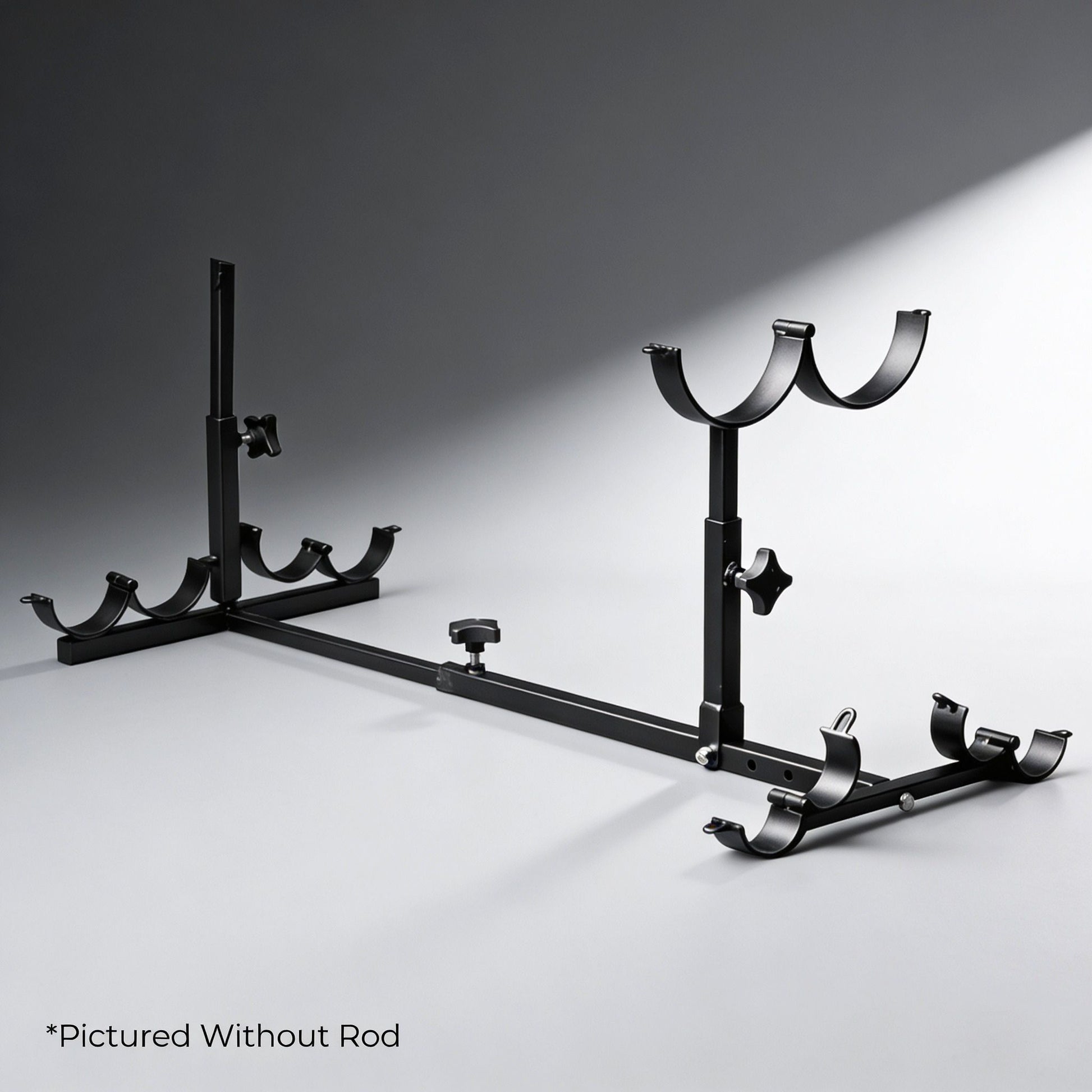 adjustable black metal stockade bondage frame with padded restraint cuffs and mounting brackets displayed without rod on gray background