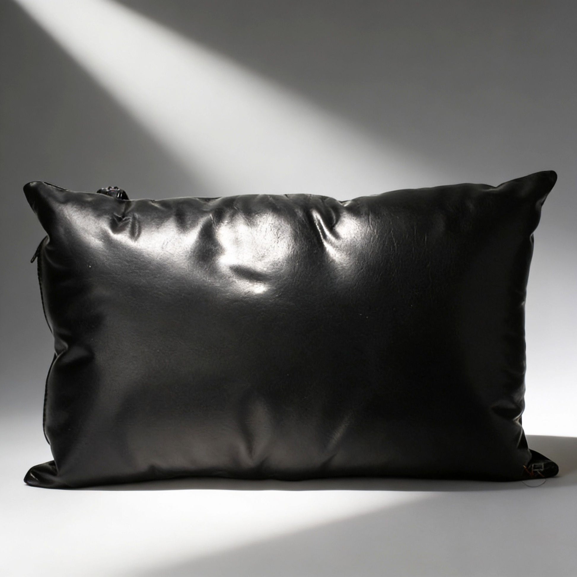 black padded support pillow for leather bondage sling with smooth cushioned surface and zipper closure