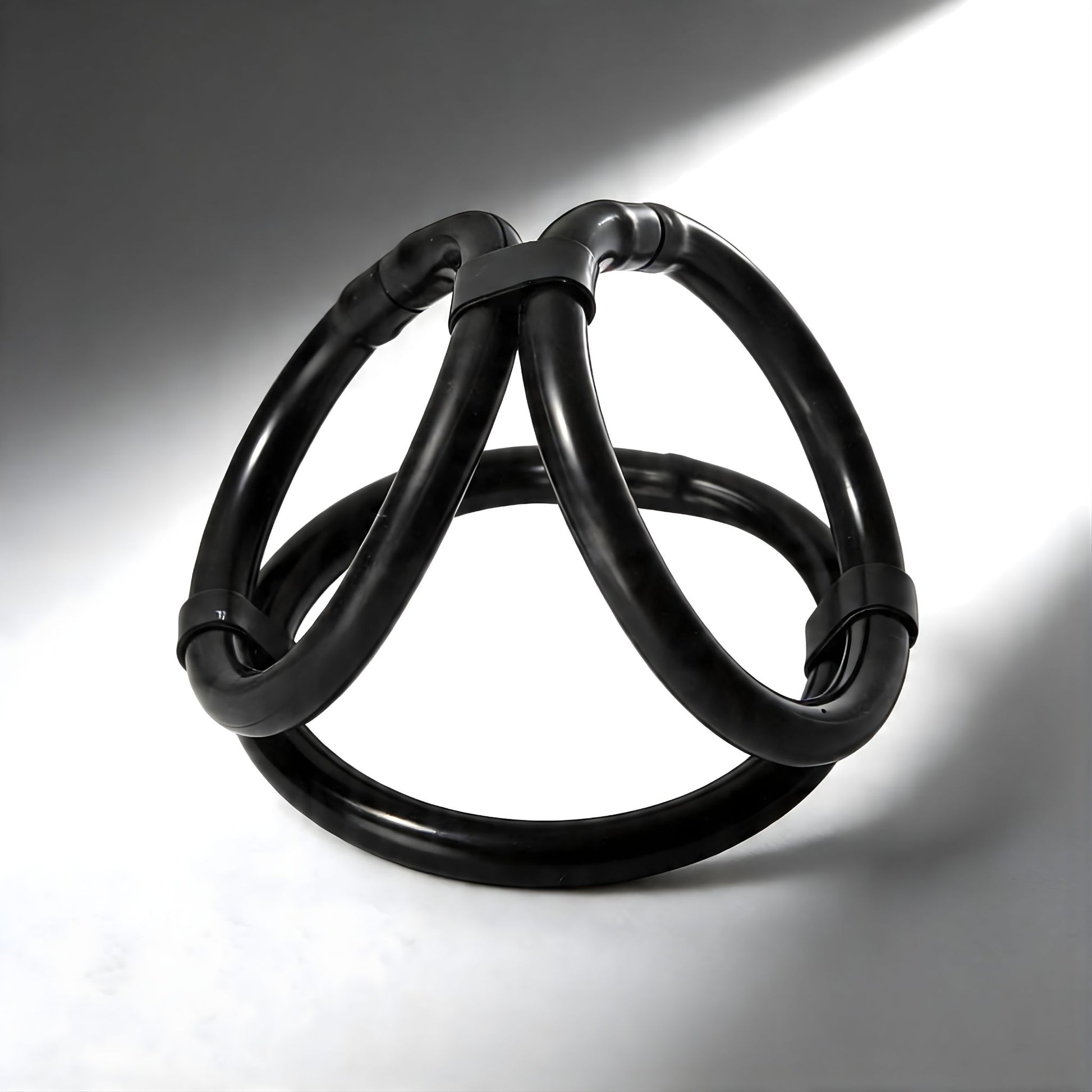 flexible black tri cock ring with easy release design and three interconnected loops for custom fit
