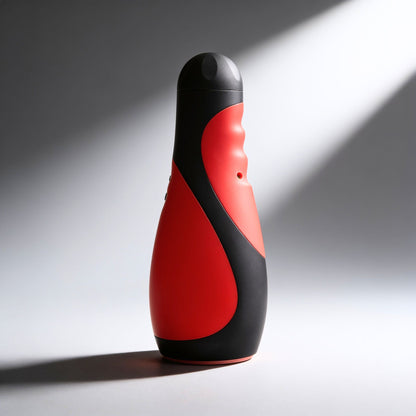 upright view of the Vibra Head Bionic Auto Stroker highlighting the ergonomic grip contours, automatic functionality, and modern black and red finish